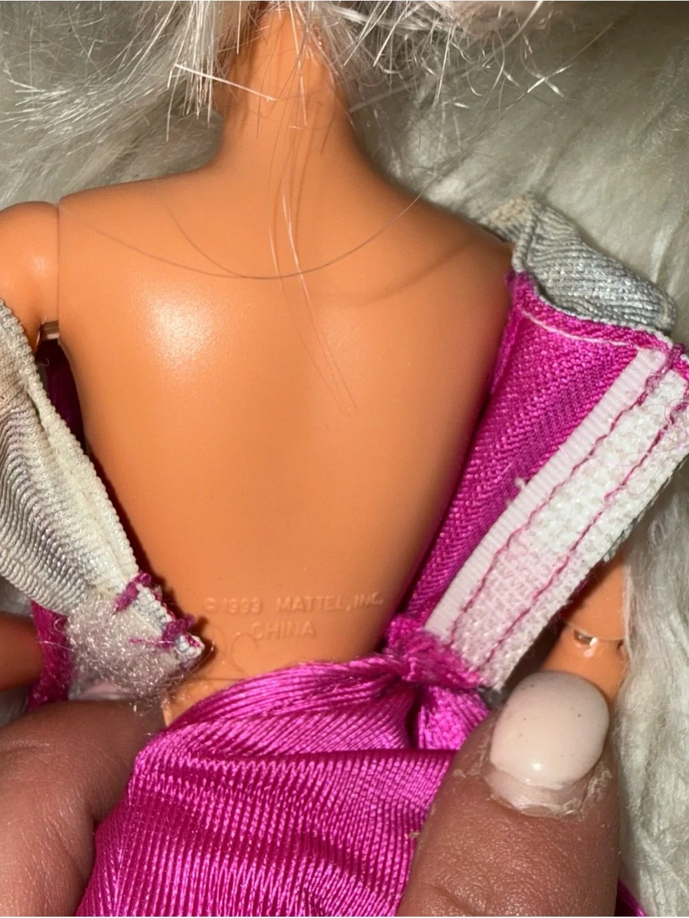 2 Barbie dolls in dresses 1 vintage 1 new chair not included